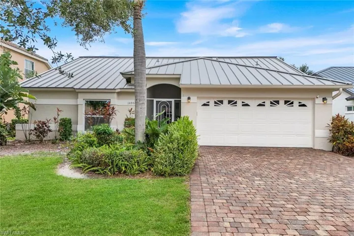 Front of home: 6-year old metal roof and 2-car garage