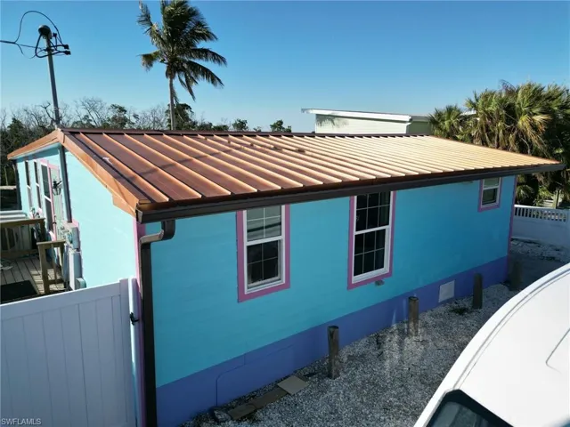 View of home's exterior with a metal roof and a standing seam roof