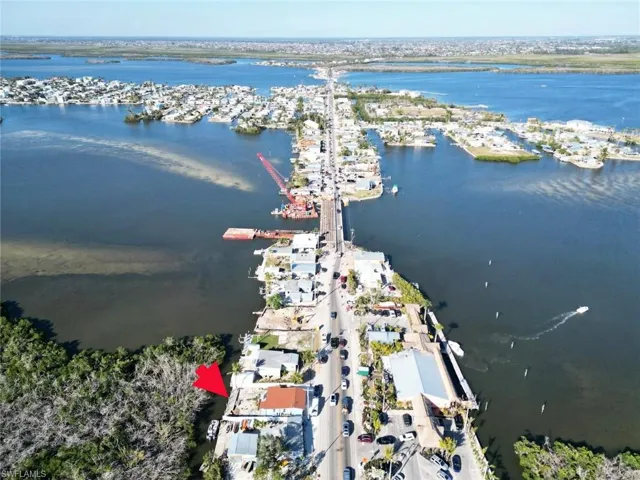 Aerial overview of property's location featuring a large body of water