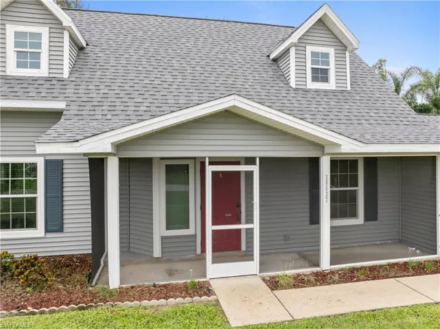 Welcoming screened front porch