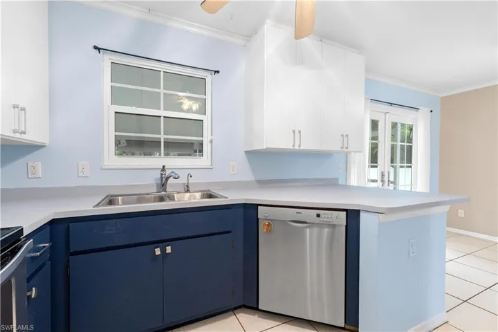 Window over sink overlooks lanai