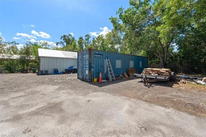 View of property with an outbuilding