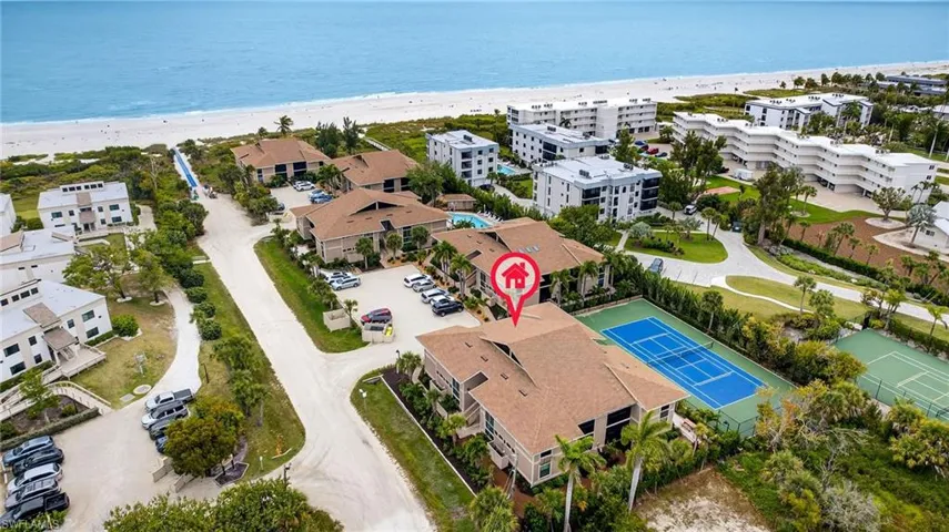 Bird's eye view of expansive beach and apartment complex / building