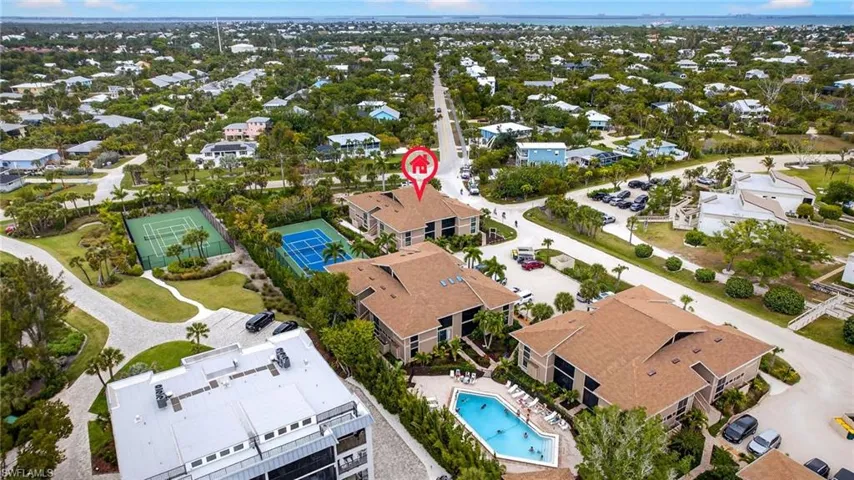 Aerial overview of property's location with nearby suburban area