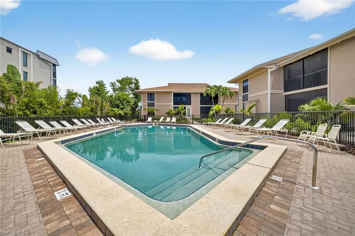 Community pool featuring a patio