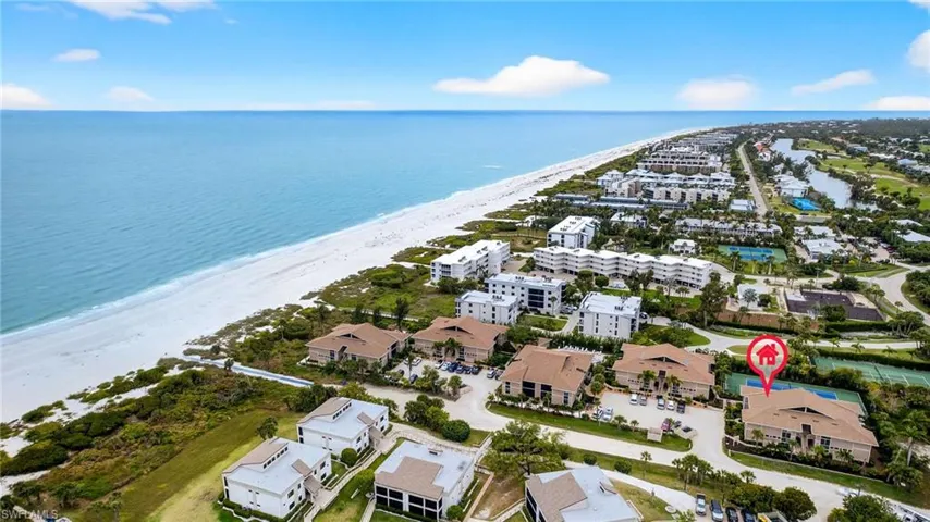 Drone / aerial view of waterfront with a beach