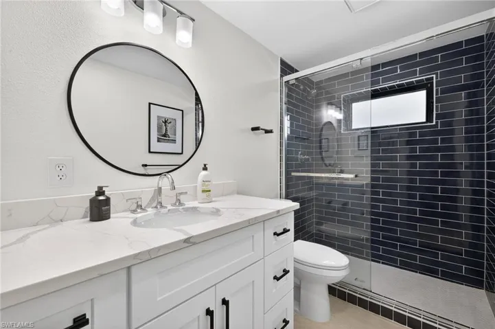 Primary Bathroom with vanity and a stall shower