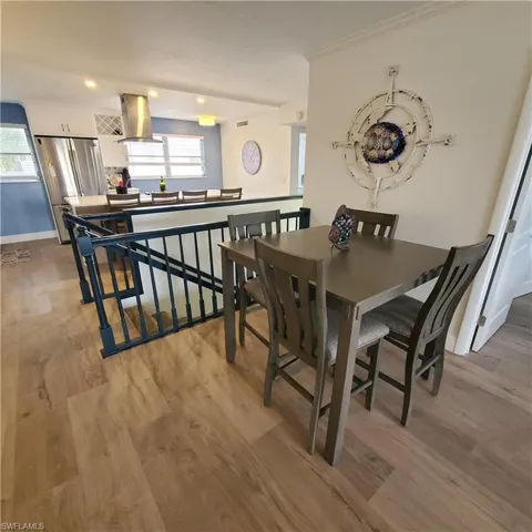 Dining space featuring recessed lighting and wood-style floors