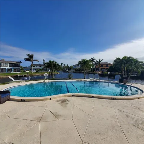 Community pool featuring a patio area