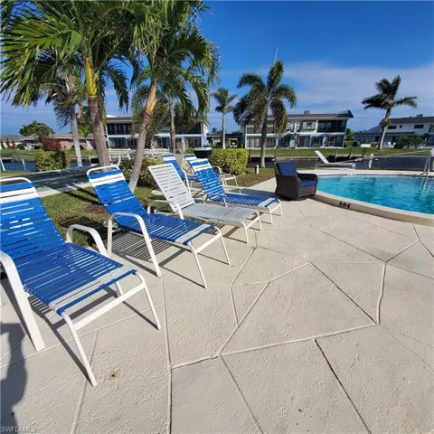 Community pool featuring a patio