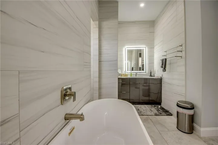 Bathroom featuring vanity and a freestanding tub