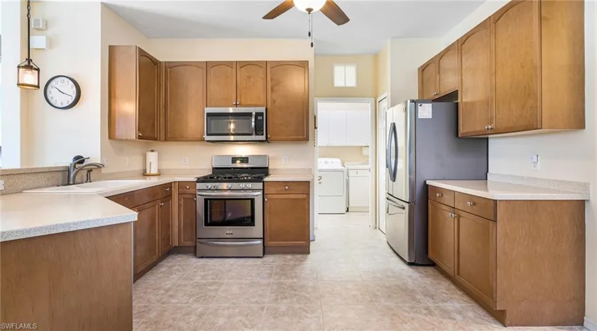 42" cabinets with stainless appliances and Corian counter-tops