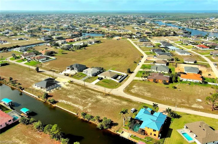 Aerial view of residential area with a large body of water