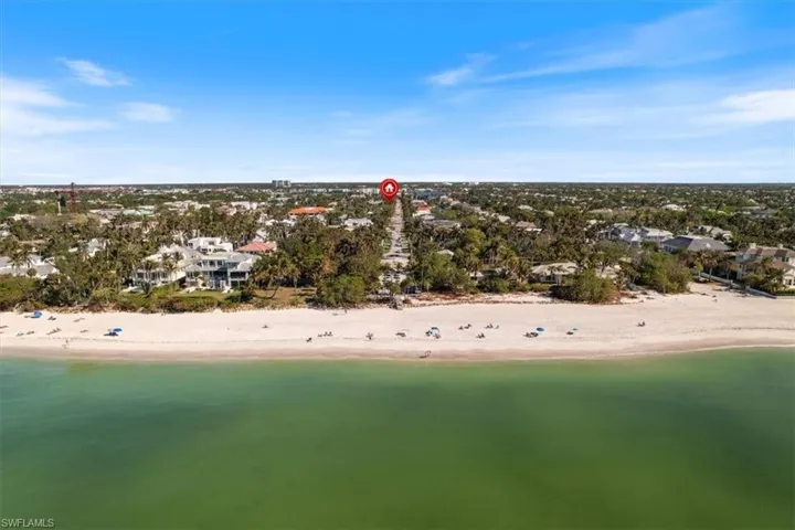 Bird's eye view with a beach view and a water view