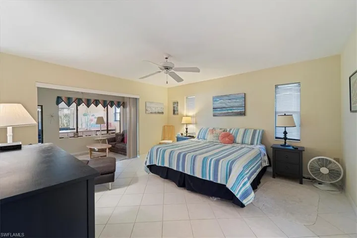 Tiled bedroom with ceiling fan