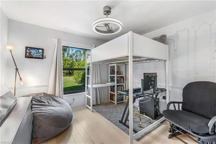 Bedroom with light hardwood / wood-style floors