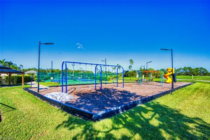 Communal playground featuring a lawn