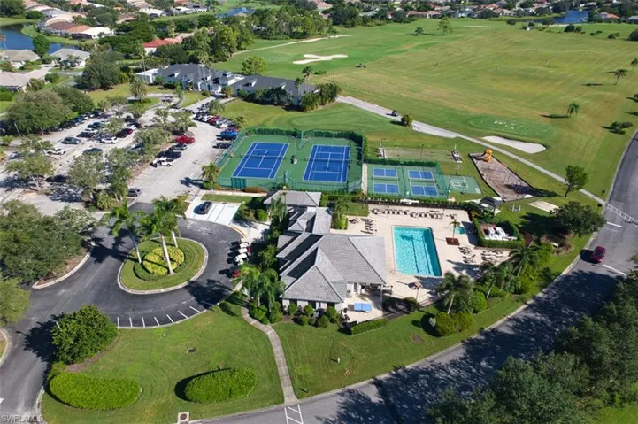 View of property location featuring a large body of water and a golf club