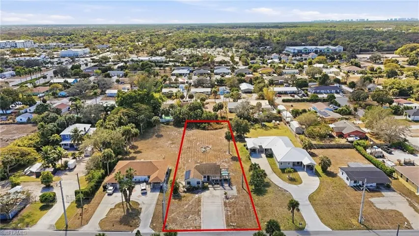 Aerial perspective of suburban area with property parcel outlined