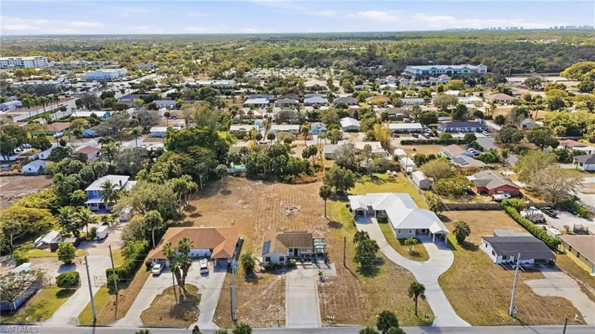 Aerial overview of property's location with nearby suburban area