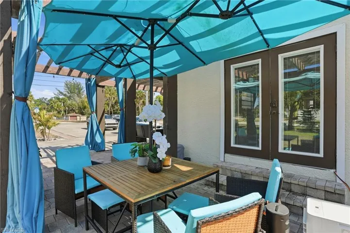 View of patio with outdoor dining space and french doors