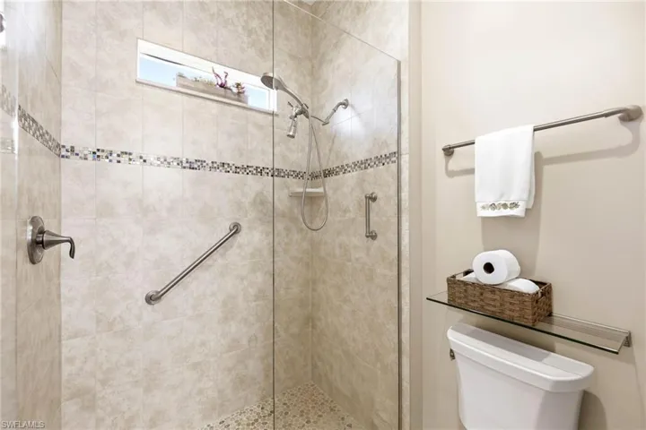 Bathroom with a walk in shower and toilet