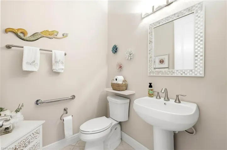 Bathroom featuring toilet and baseboards