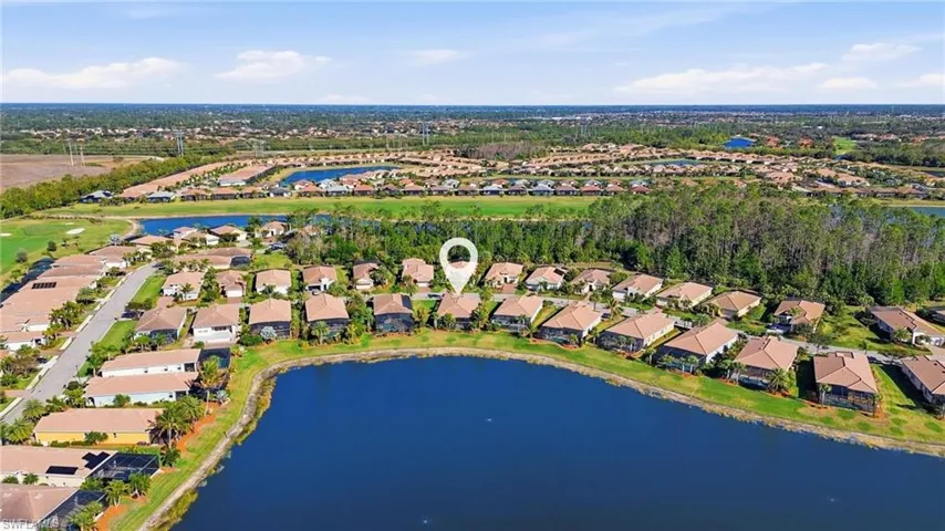Aerial view of residential area with a large body of water
