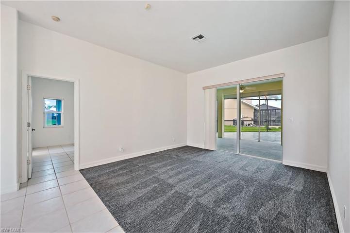 The formal living room looking towards the entryway and the dining room