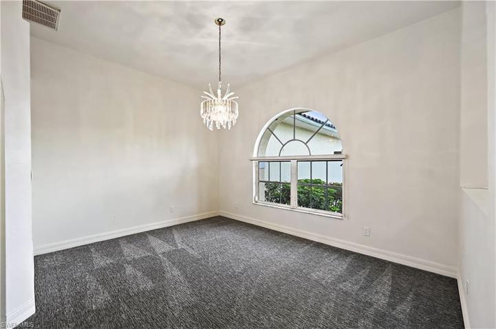 A view of the formal dining room and front entry from the formal living room