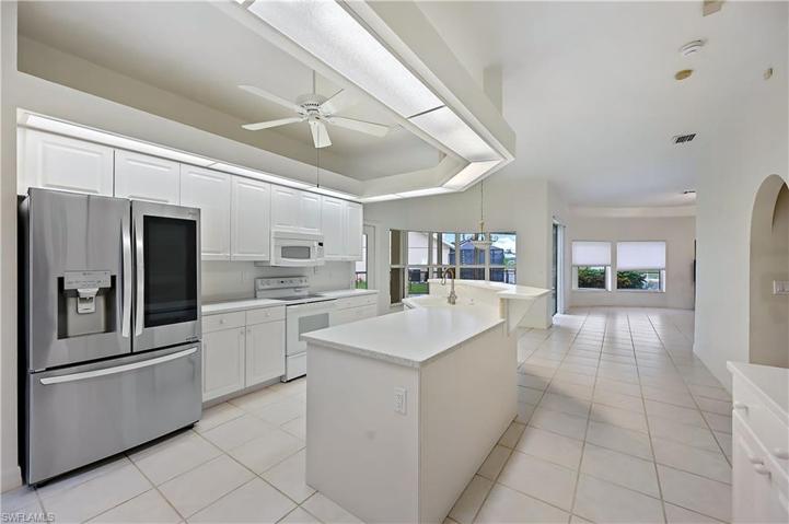 Kitchen, formal dining room (left) and lanai (right)