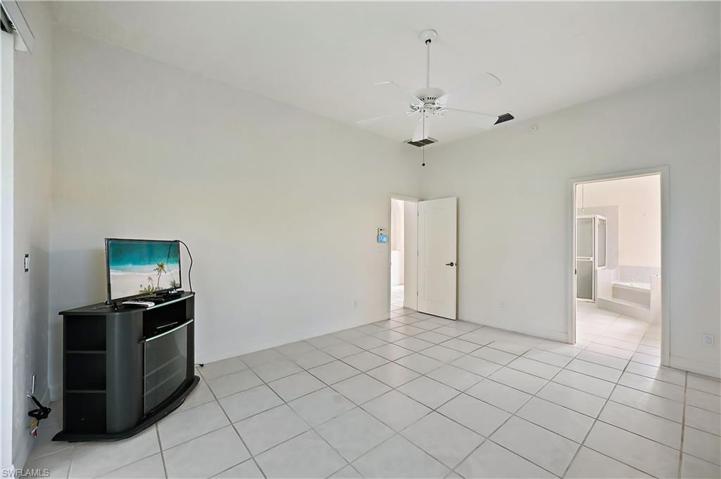 The primary bedroom has sliders to the pool
