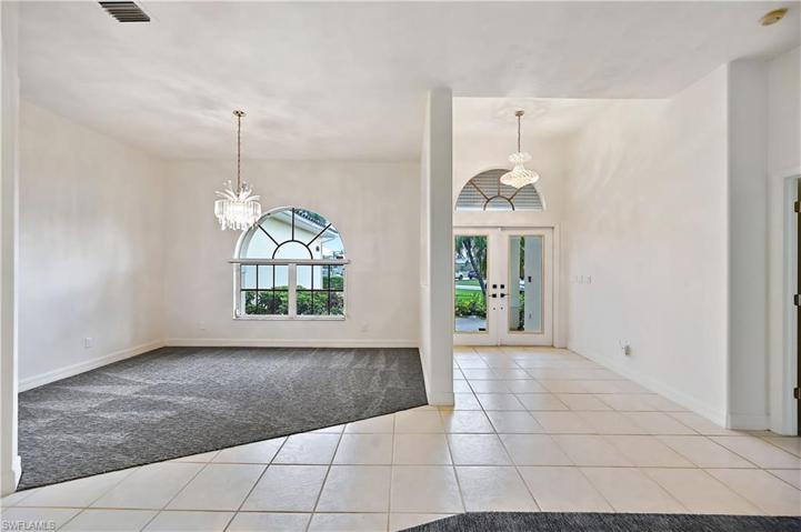 High ceilings and brightness surround you as you enter the home.