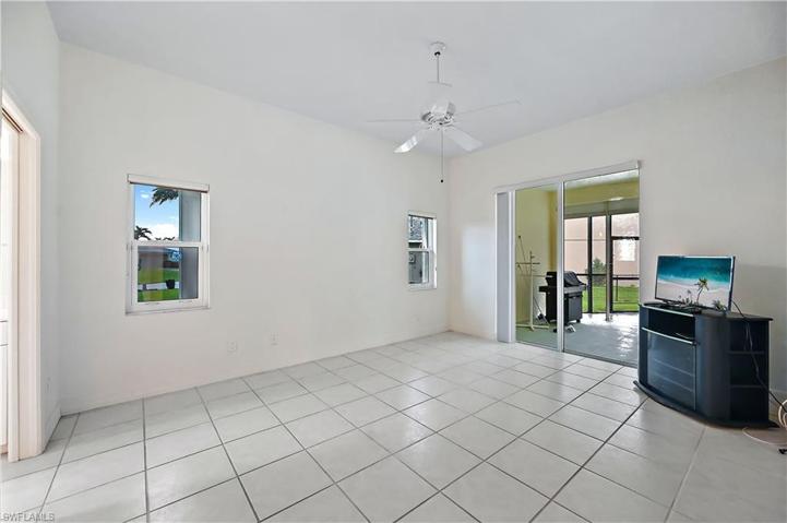 View of the living room and into the primary bedroom
