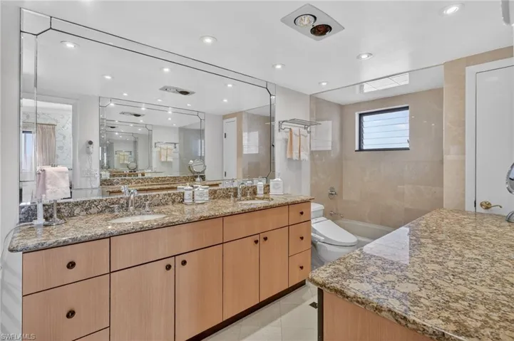 Primary bathroom features double vanities