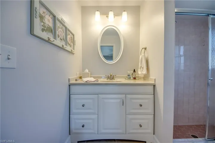 Bathroom with vanity and walk in shower