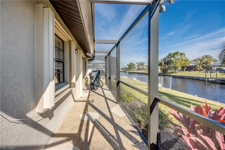 Sunroom / solarium with a water view