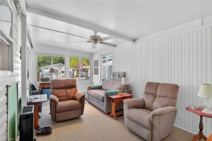 Sunroom / solarium with beamed ceiling