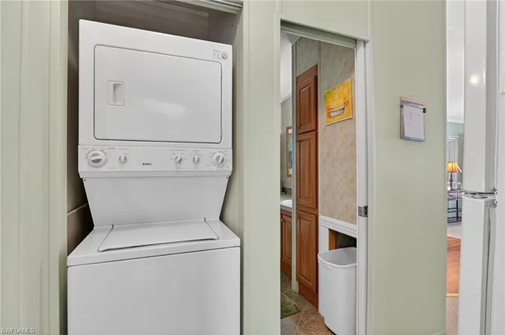 Laundry room featuring stacked washer / dryer