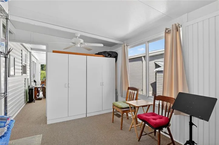 Living area with light carpet