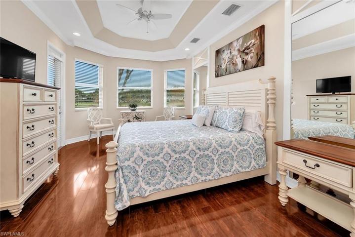 Notice the gorgeous hard wood flooring when you enter this Master Bedroom. Surrounded by windows and a private door to the lanai.