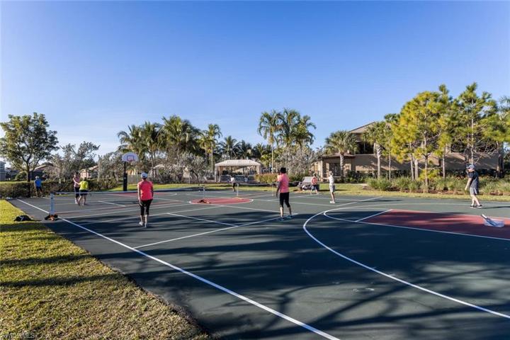 Residents having fun playing pickleball.