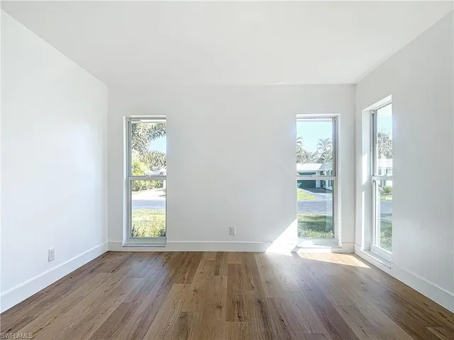 Spare room featuring light wood-type flooring