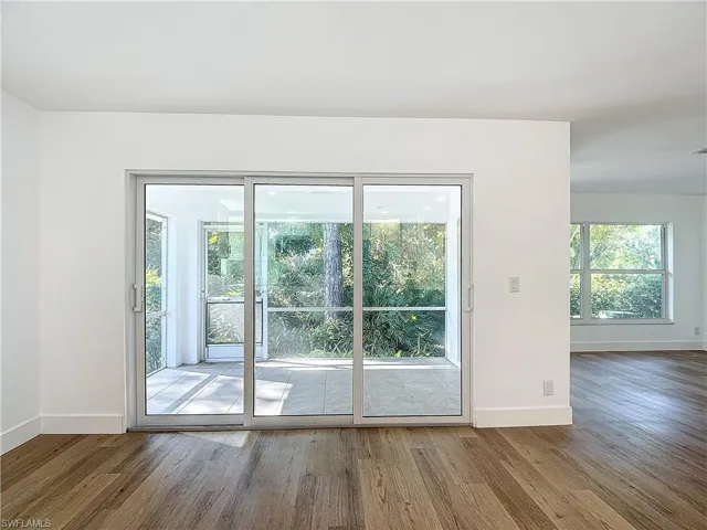 Doorway to outside featuring hardwood / wood-style floors