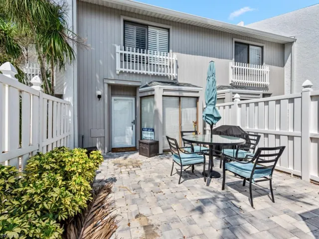 Back of house with a patio