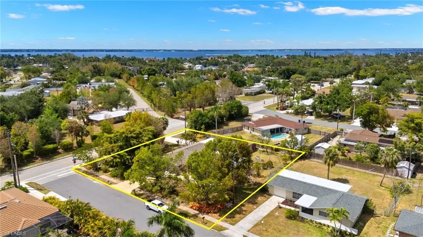 Drone / aerial view with a residential view and a water view