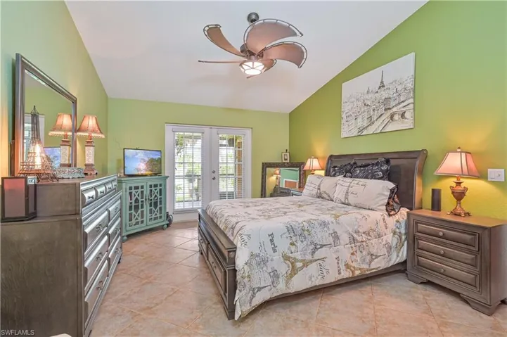 Room featuring vaulted ceilings and ceramic tile flooring