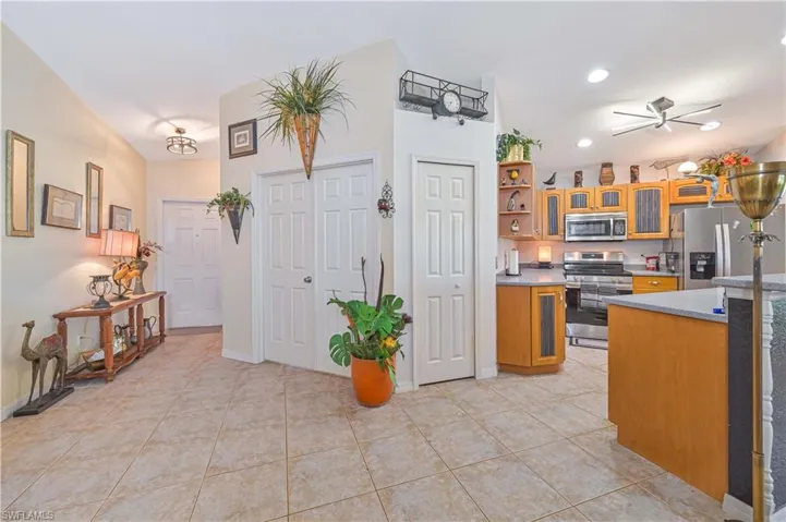Open-concept interior featuring large format tile flooring throughout