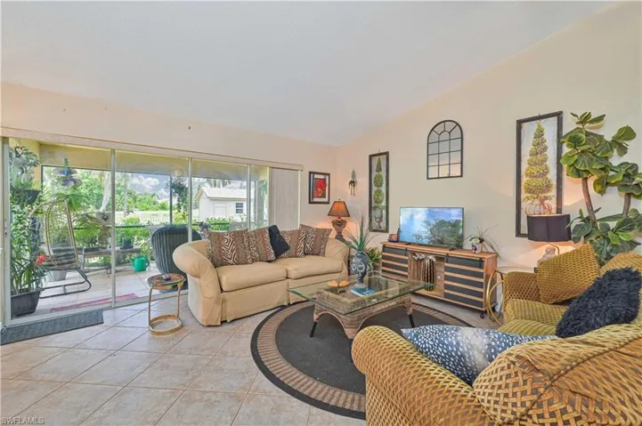 Living area with neutral wall color and tile flooring