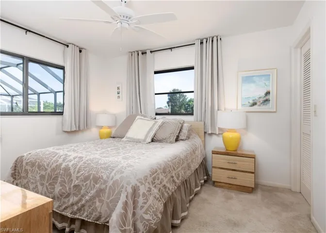 Bright room featuring neutral carpeting and white painted walls